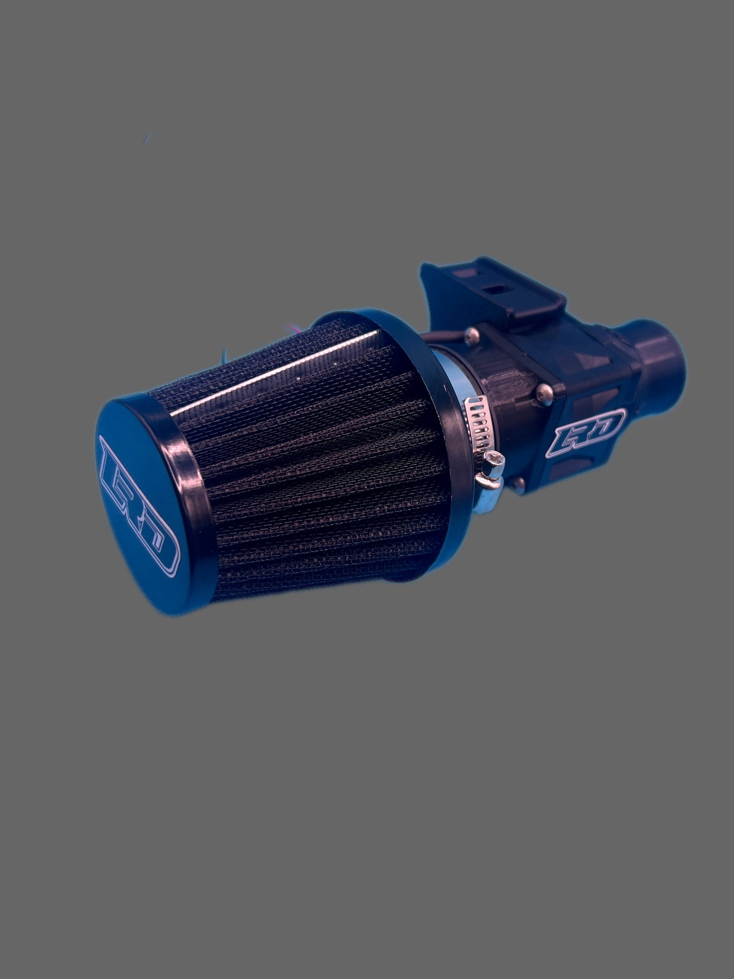 Off-road helmet fan with washable high-flow filter installed